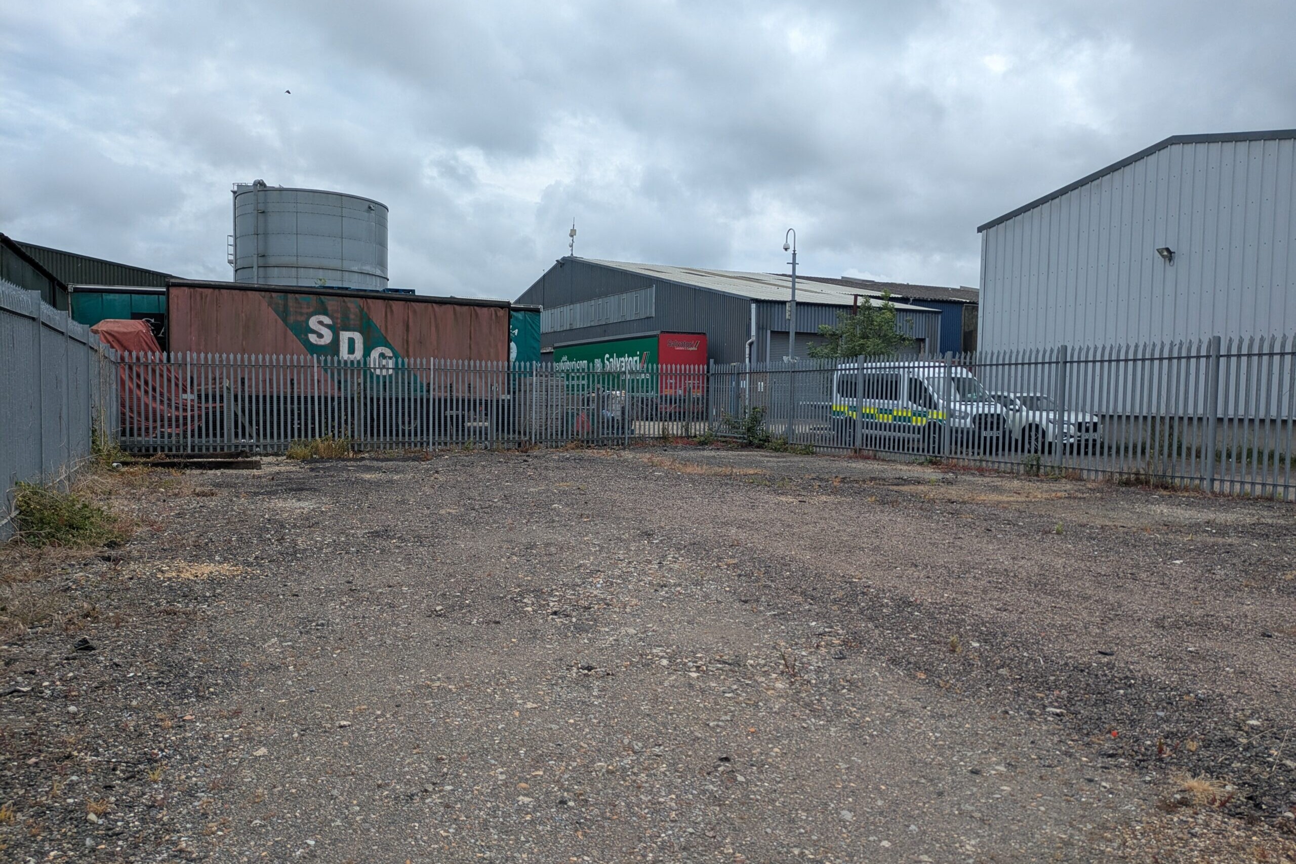 Photograph of empty, surfaced yard taken from North-East corner
