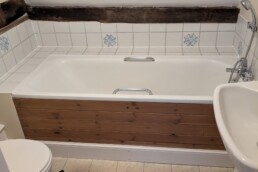 Bathroom including bath, sink and toilet