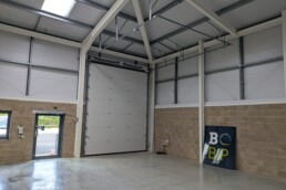 Interior of Unit 2 Broad Oak Business Park showing the front of the premises and roller shutter door and access.